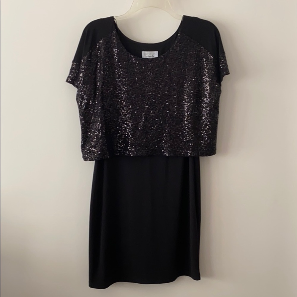 Black dress with black sequins on the top.